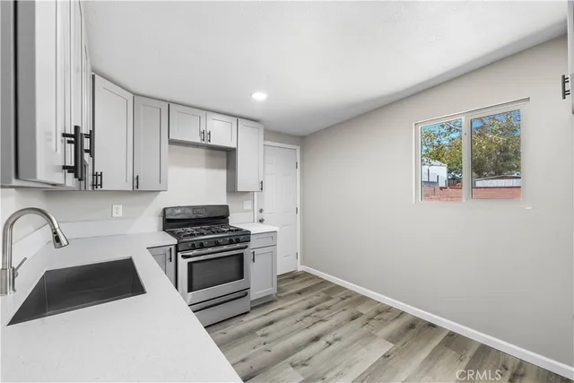 a kitchen with a stove and a microwave