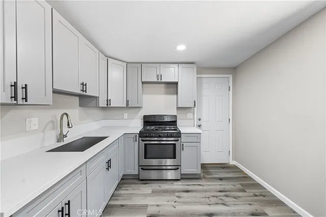 a kitchen with a stove and a sink