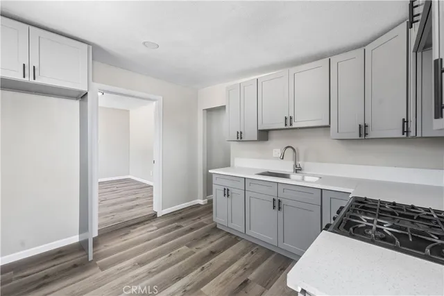 a kitchen with a sink and cabinets