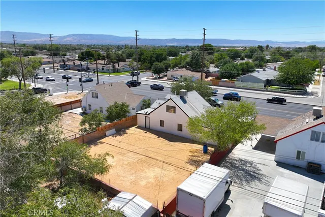 an aerial view of a house with a yard basket ball court and outdoor seating