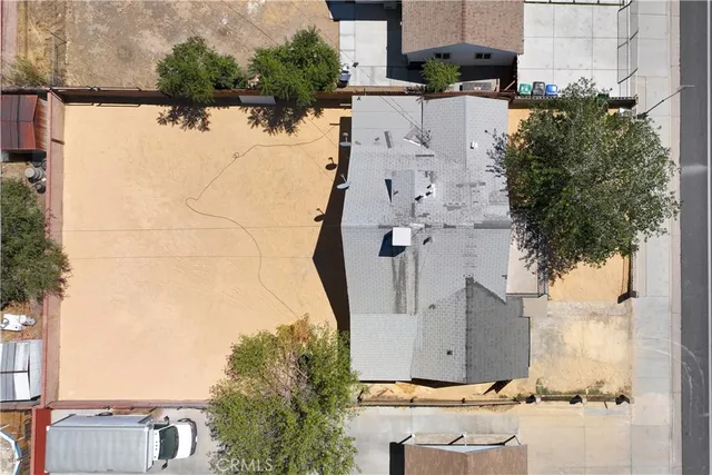 an aerial view of residential house with outdoor space and parking