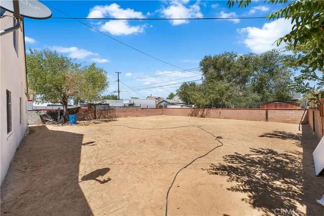 a view of a backyard of the house