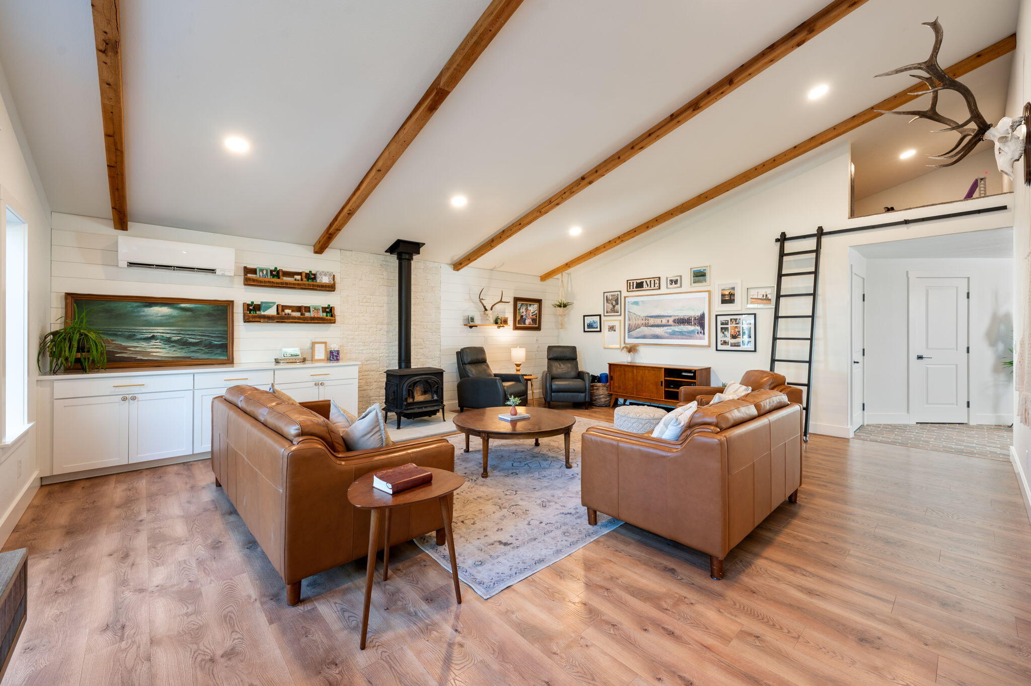 60072 Cinder Butte Road Bend, OR 97702 - Photo 12 of 60 a living room with fireplace furniture and a flat screen tv