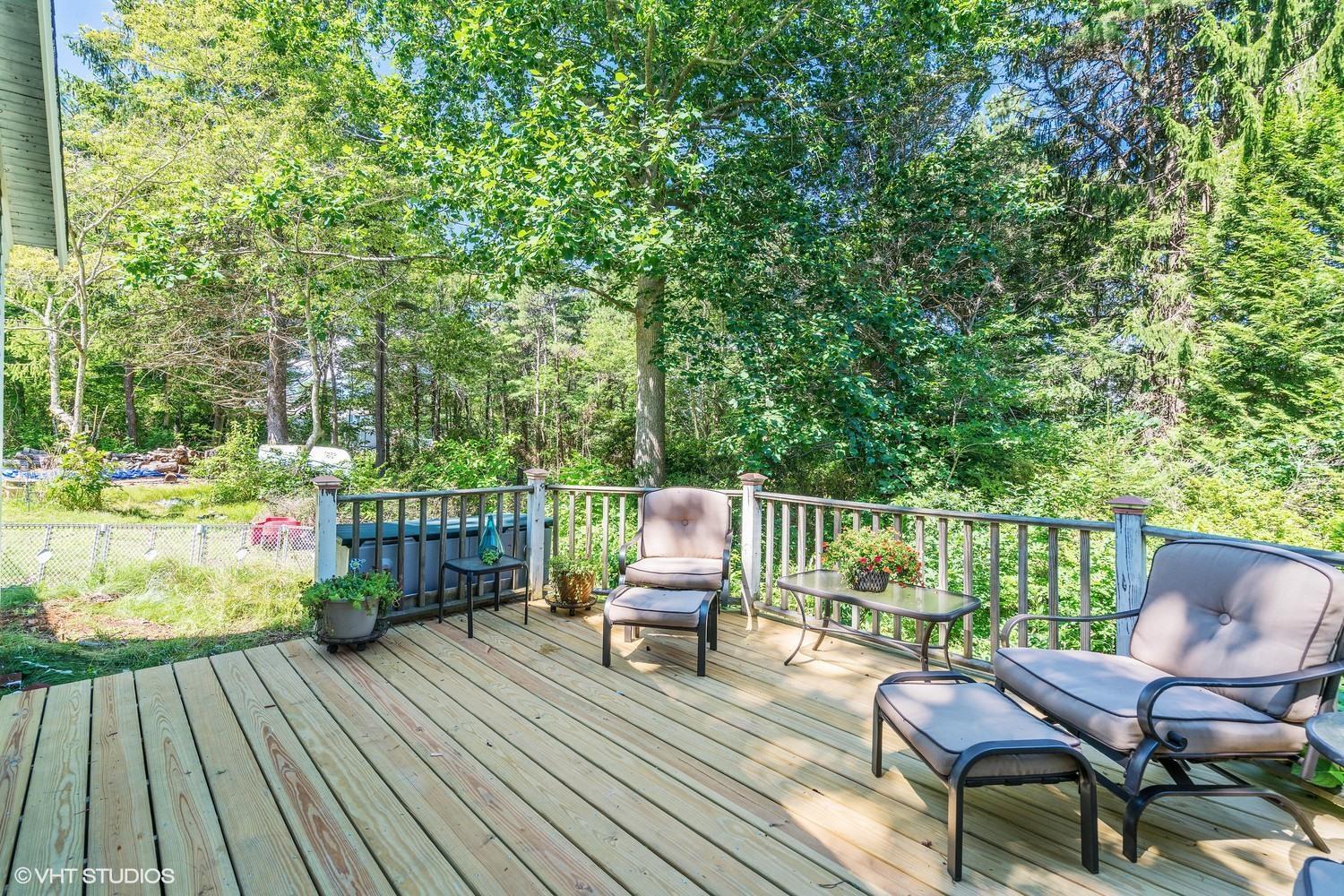 16 Pimlico Pond Road Forestdale, MA 02644 - Photo 3 of 10 a balcony with wooden floor table and chairs