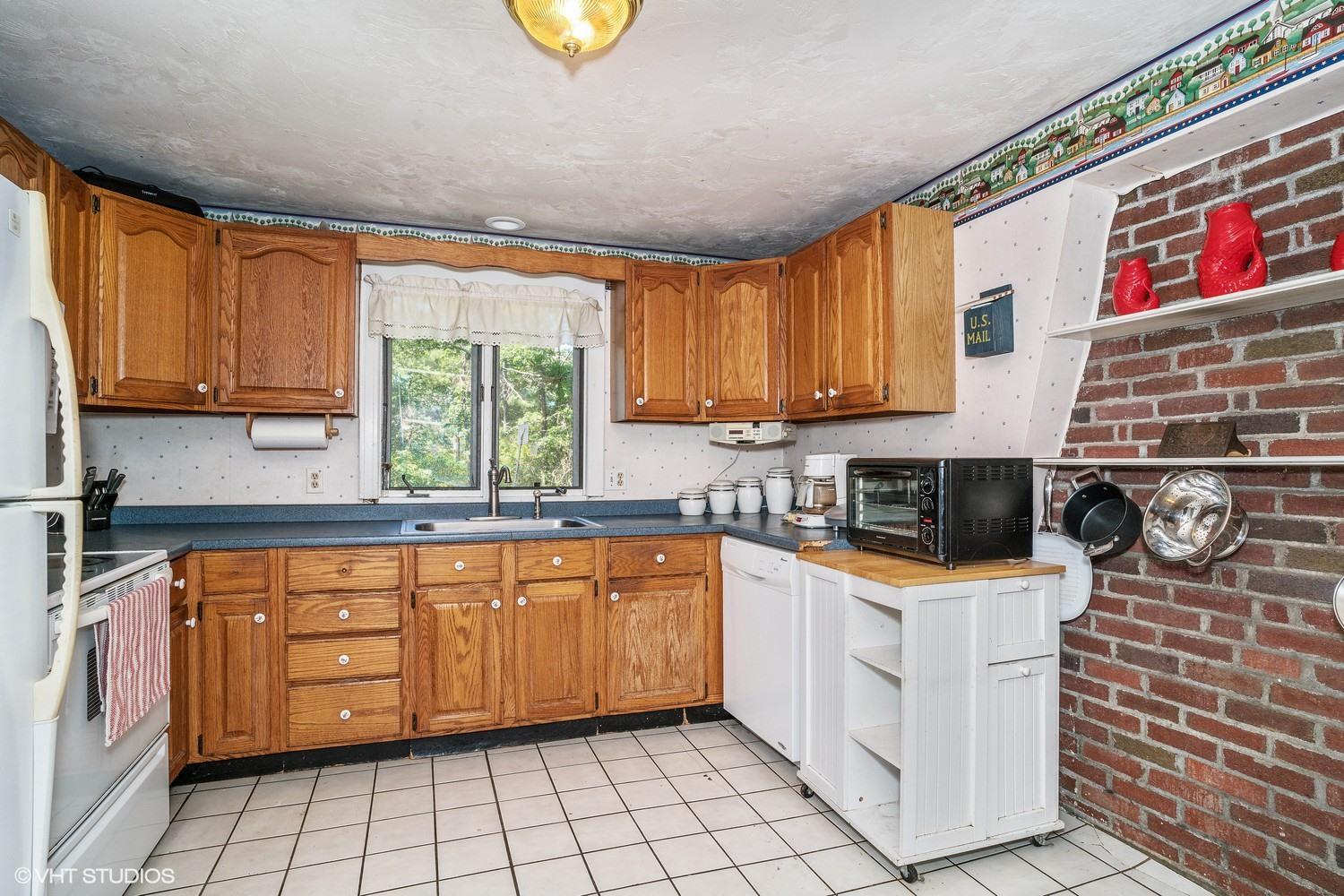 16 Pimlico Pond Road Forestdale, MA 02644 - Photo 8 of 10 a kitchen with stainless steel appliances a stove a sink and a microwave