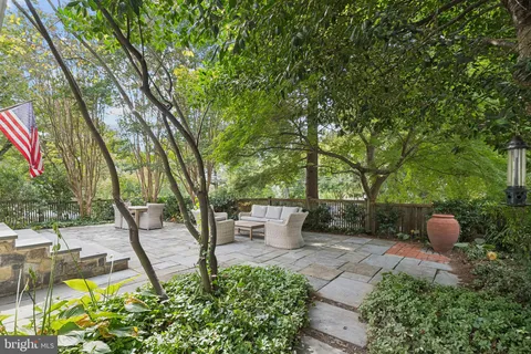 a view of a backyard with sitting area