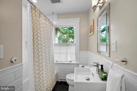 a bathroom with a sink and a window