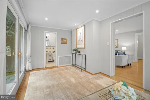 a view of a bedroom with wooden floor and a bedroom