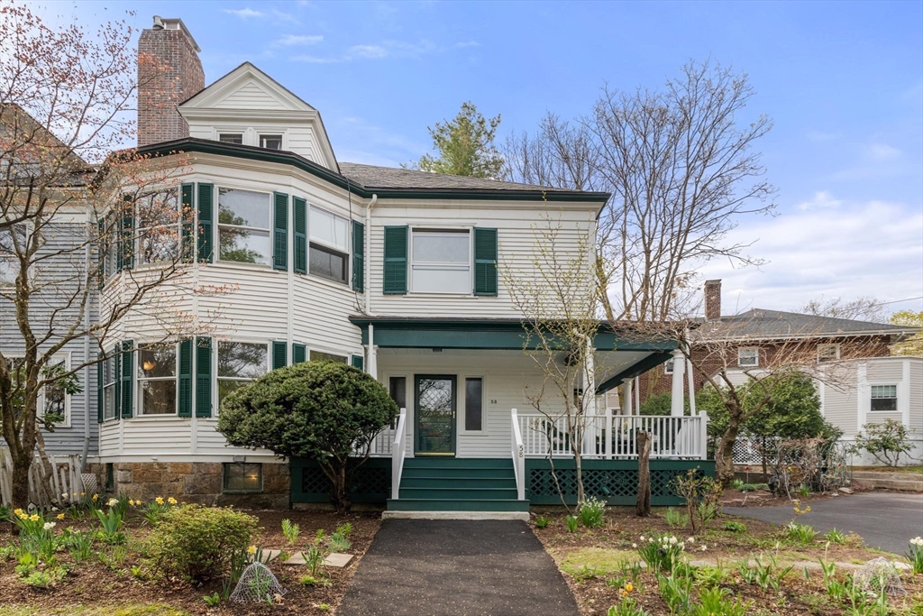 58 Corey Road Brookline, MA 02445 - Photo 2 of 8 a front view of a house with garden