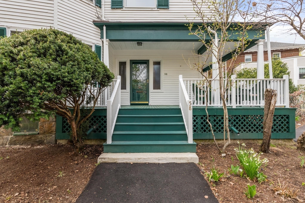 58 Corey Road Brookline, MA 02445 - Photo 3 of 8 a front view of a house with a yard