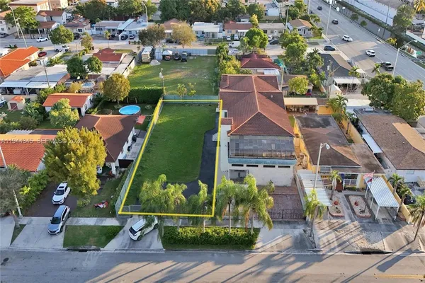 an aerial view of a house with a garden