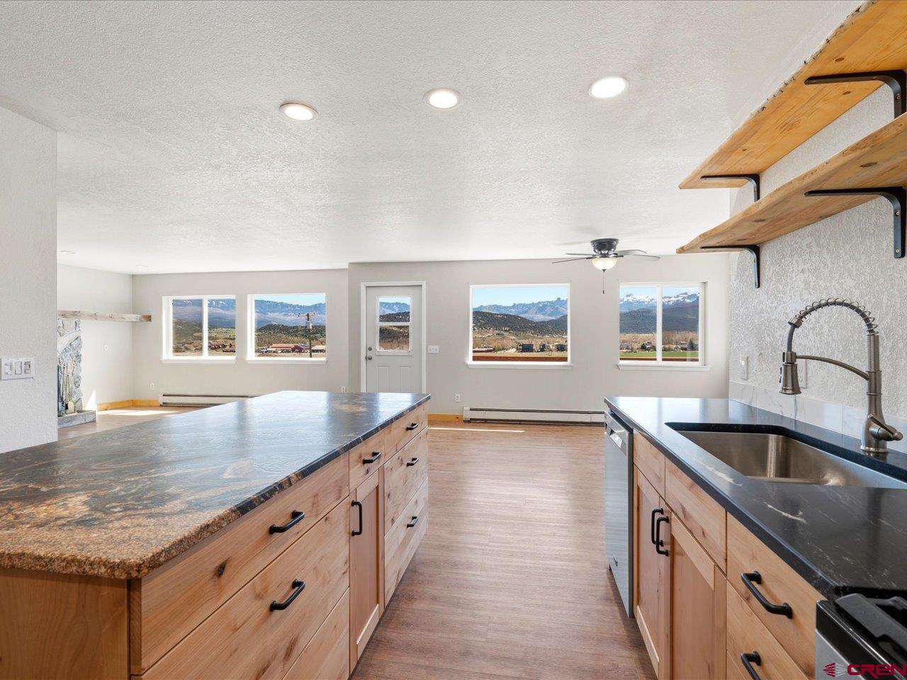 495 North Amelia Street Ridgway, CO 81432 - Photo 13 of 41 a kitchen with granite countertop a sink and a stove