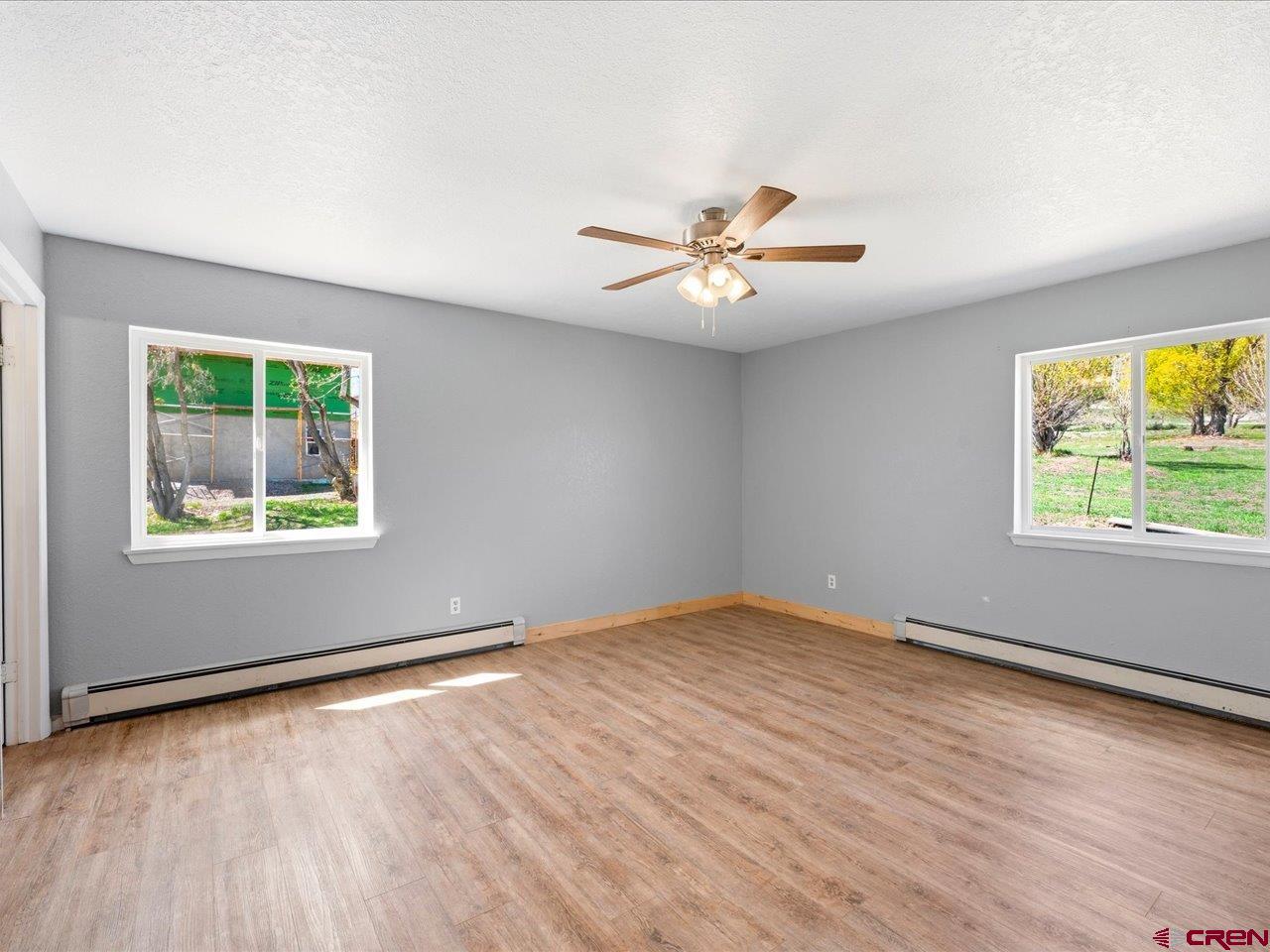 495 North Amelia Street Ridgway, CO 81432 - Photo 15 of 41 wooden floor in an empty room with a window