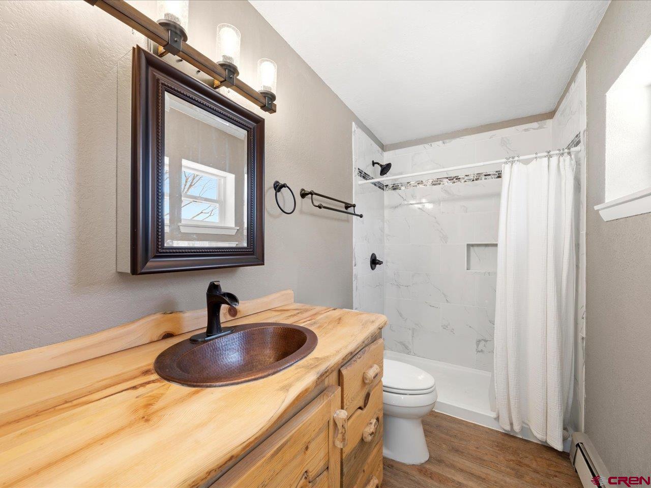 495 North Amelia Street Ridgway, CO 81432 - Photo 17 of 41 a bathroom with a sink a toilet and shower