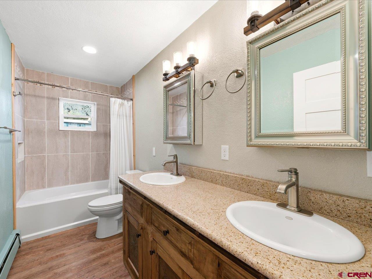 495 North Amelia Street Ridgway, CO 81432 - Photo 21 of 41 a bathroom with a double vanity sink and a mirror
