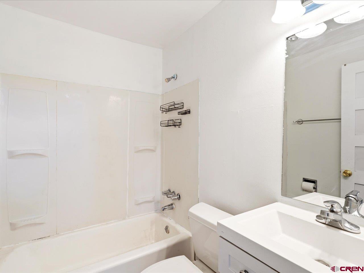 495 North Amelia Street Ridgway, CO 81432 - Photo 27 of 41 a bathroom with a sink a toilet and shower