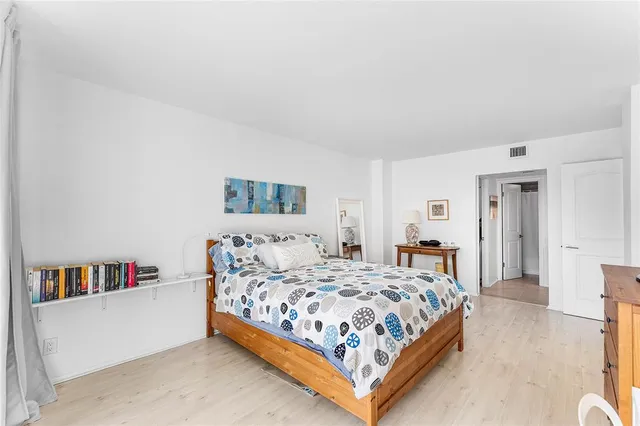 a bedroom with a bed and a couch