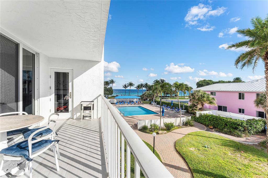 800 Southeast 20th Avenue, Unit 206 Deerfield Beach, FL 33441 - Photo 20 of 37 a view of a patio with swimming pool