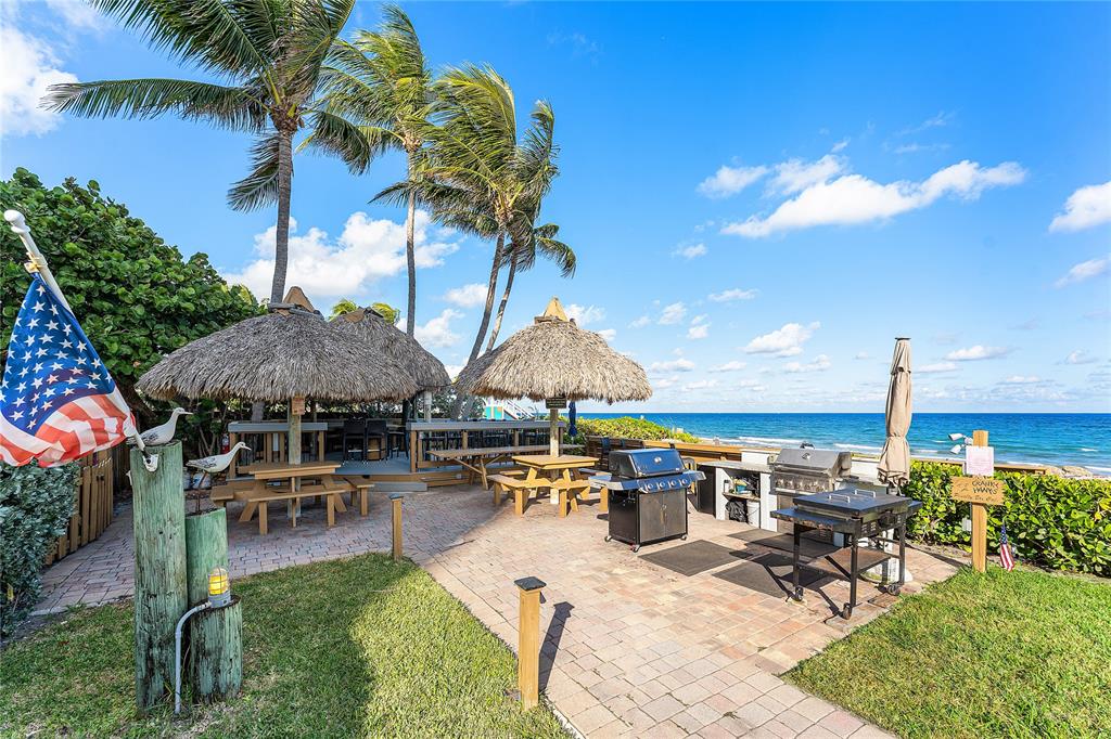 800 Southeast 20th Avenue, Unit 206 Deerfield Beach, FL 33441 - Photo 26 of 37 a swimming pool with outdoor seating yard and barbeque oven