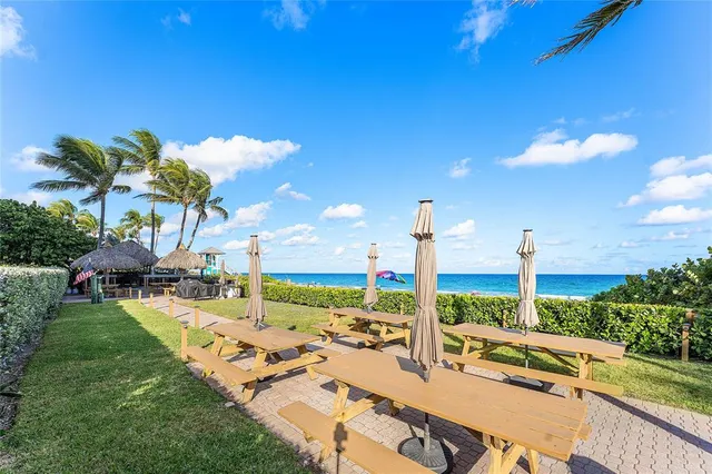 a view of a patio with swimming pool