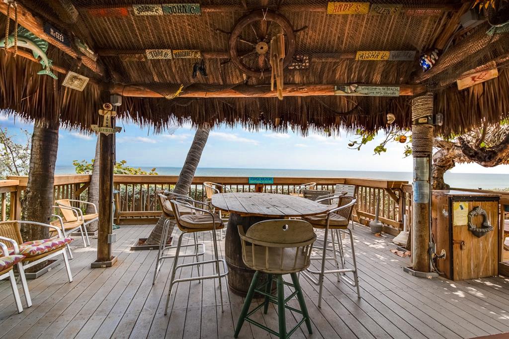 800 Southeast 20th Avenue, Unit 206 Deerfield Beach, FL 33441 - Photo 30 of 37 a patio with wooden floor a barbeque grill and outdoor seating