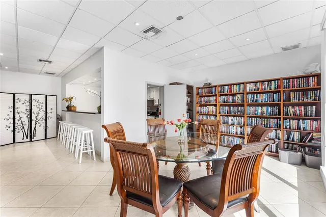 a dining room with furniture and window