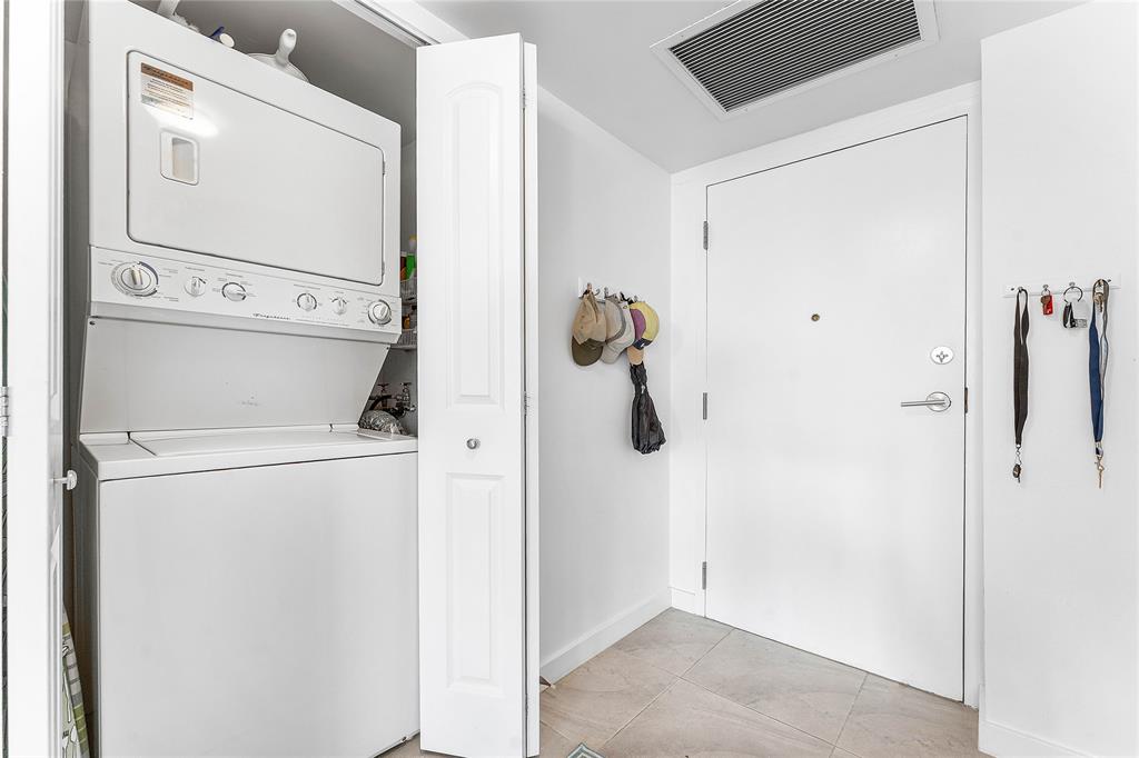 800 Southeast 20th Avenue, Unit 206 Deerfield Beach, FL 33441 - Photo 7 of 37 a utility room with dryer and washer