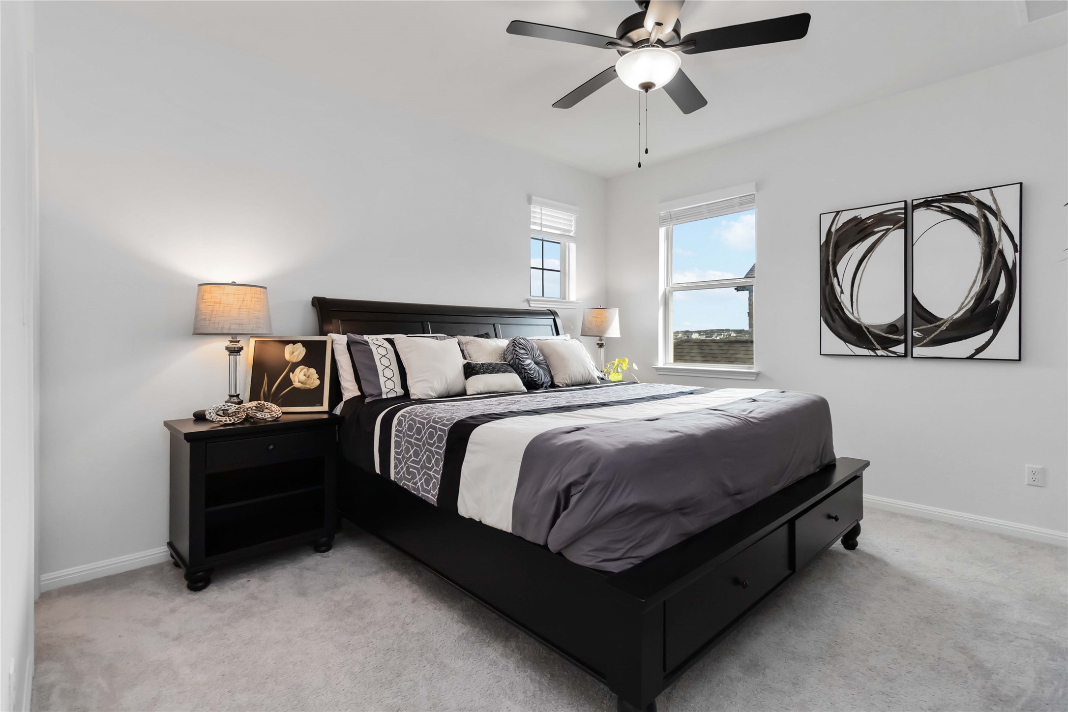 4705 Modena Bay Bend Leander, TX 78641 - Photo 29 of 40 Bedroom with light colored carpet and ceiling fan