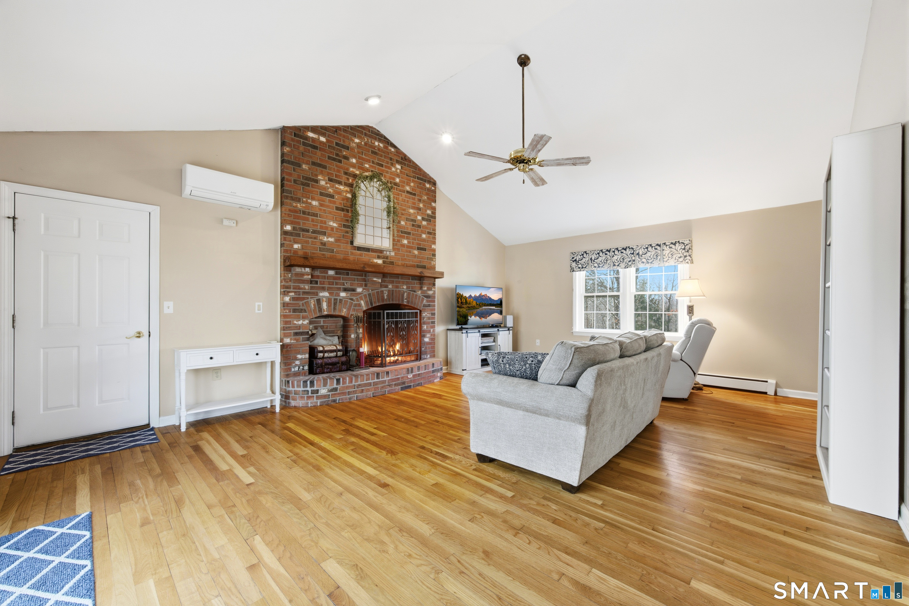 48 Bittersweet Drive Ledyard, CT 06335 - Photo 11 of 38 a living room with furniture and a fireplace