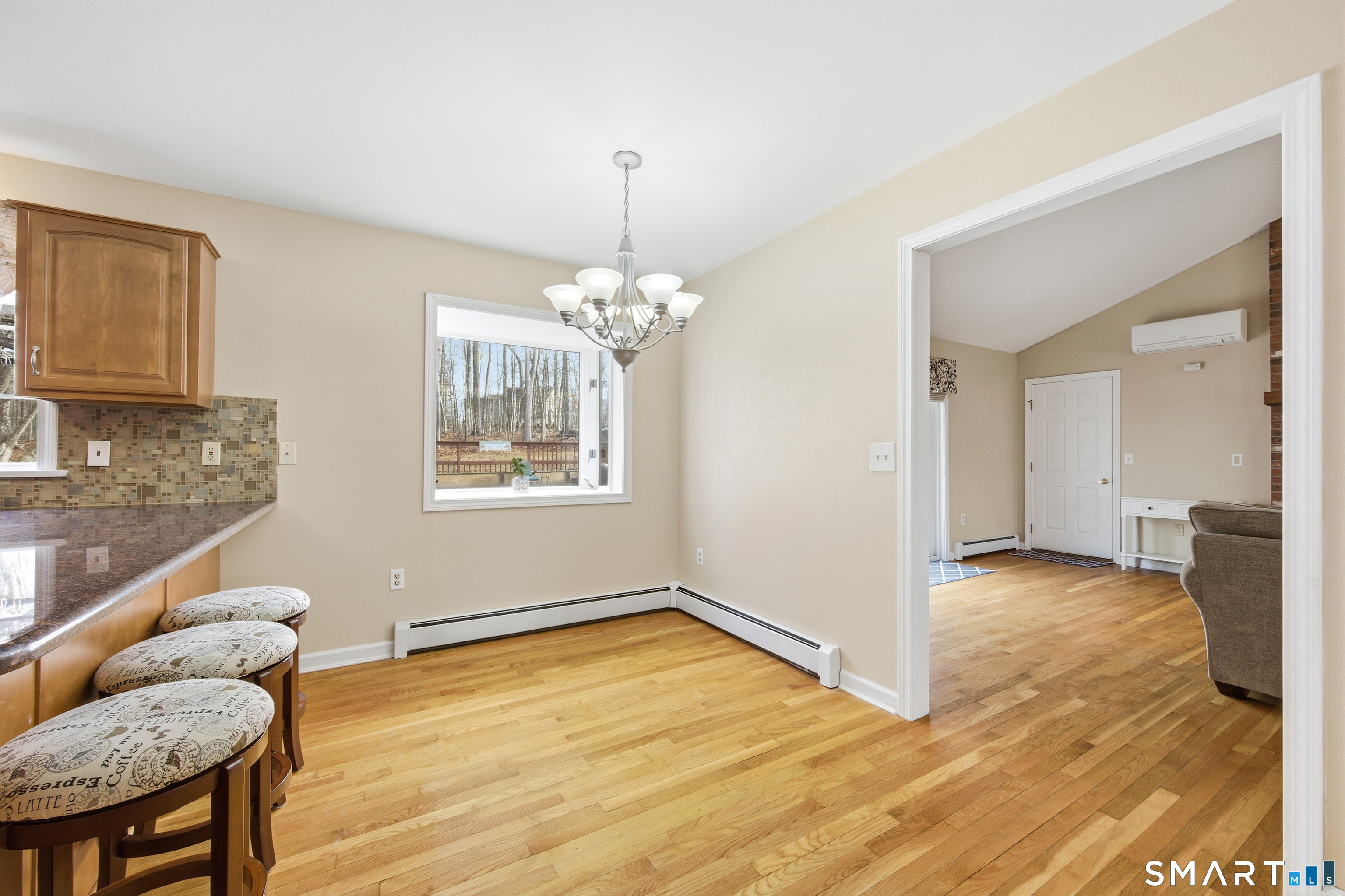 48 Bittersweet Drive Ledyard, CT 06335 - Photo 12 of 38 a view of an empty room with window and wooden floor