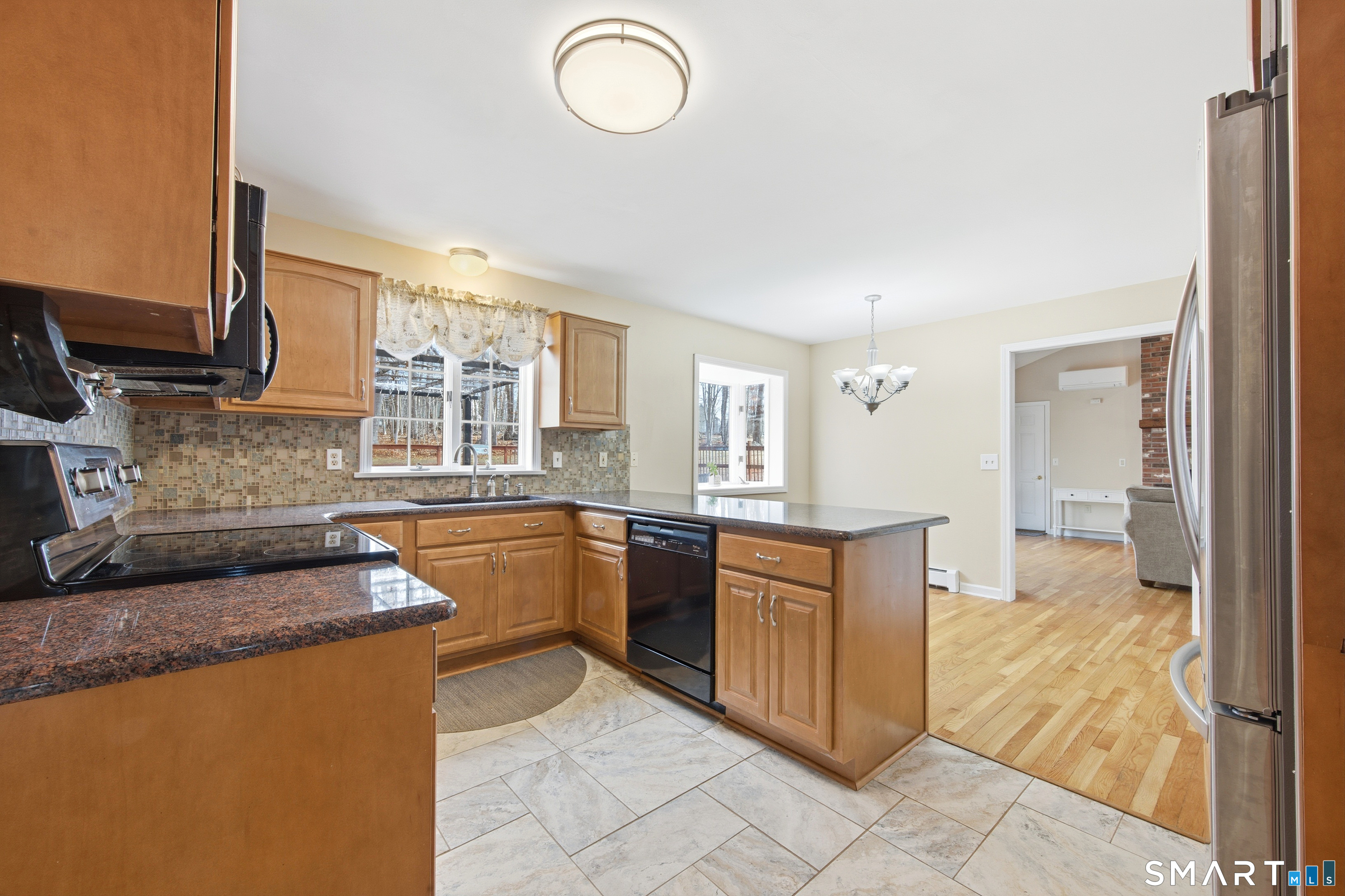 48 Bittersweet Drive Ledyard, CT 06335 - Photo 17 of 38 a kitchen with stainless steel appliances granite countertop a stove a sink and a refrigerator