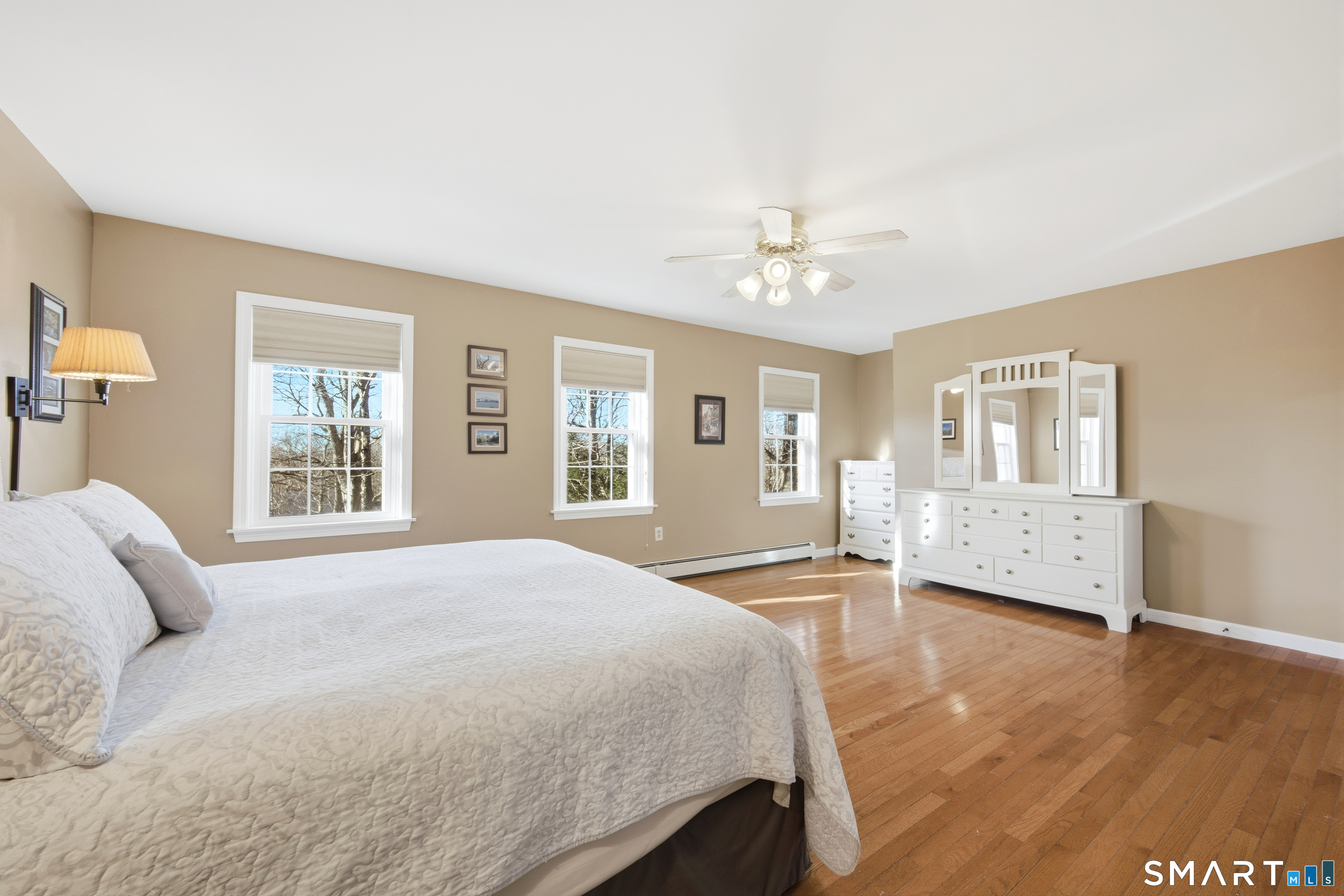 48 Bittersweet Drive Ledyard, CT 06335 - Photo 24 of 38 a spacious bedroom with a bed a dresser and next to a window