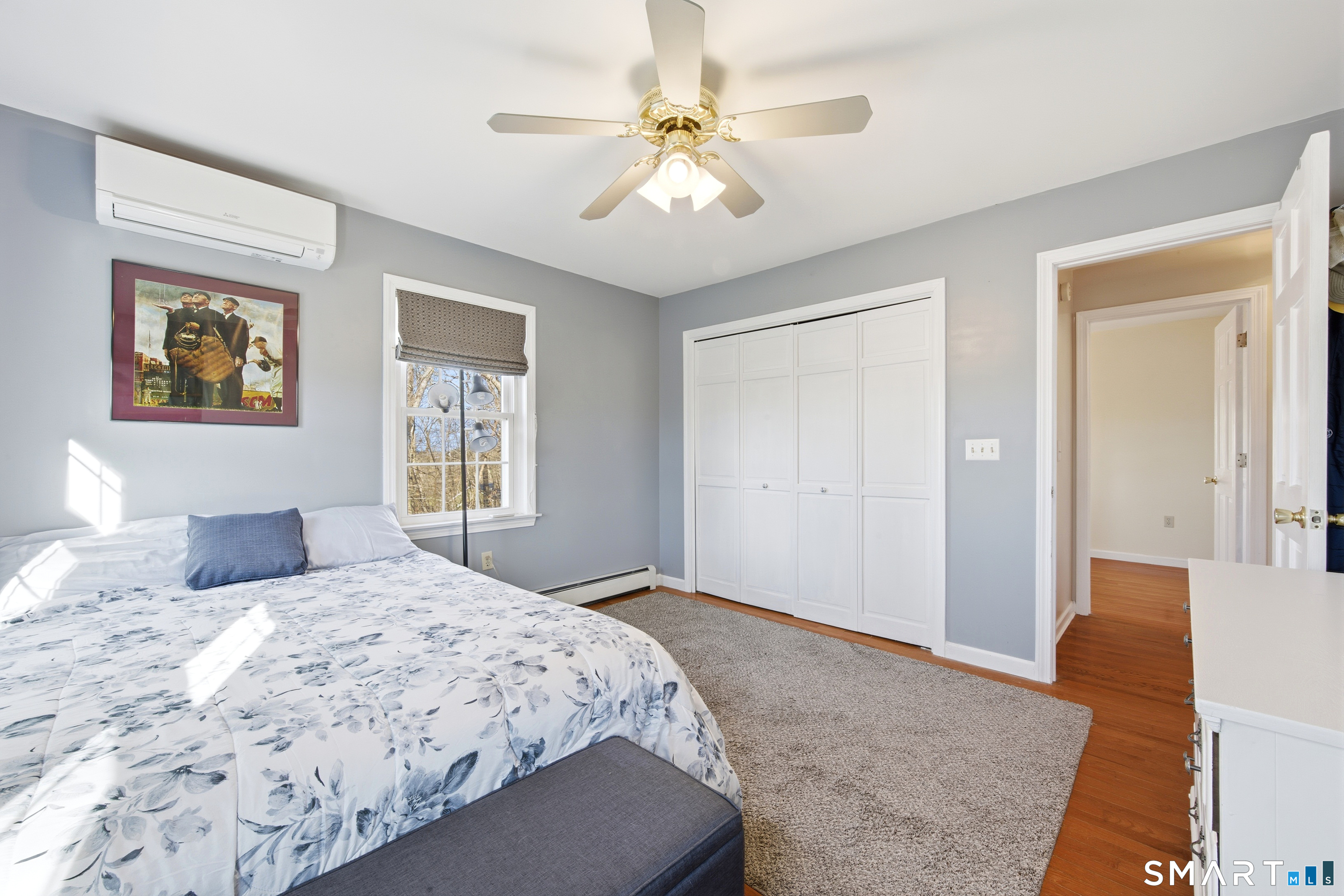 48 Bittersweet Drive Ledyard, CT 06335 - Photo 28 of 38 a bedroom with a large bed and a chandelier