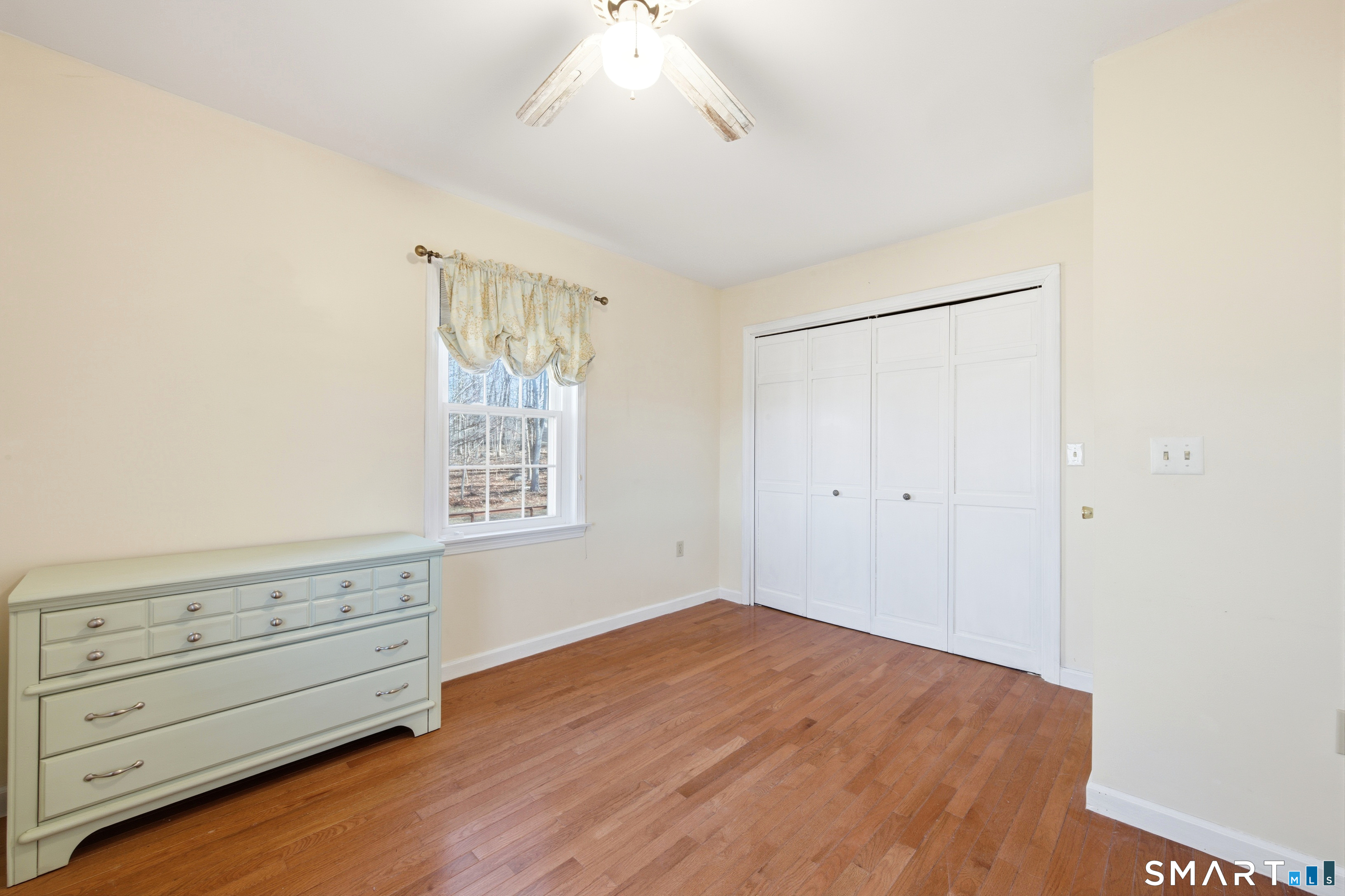 48 Bittersweet Drive Ledyard, CT 06335 - Photo 30 of 38 a view of an empty room with wooden floor and a window