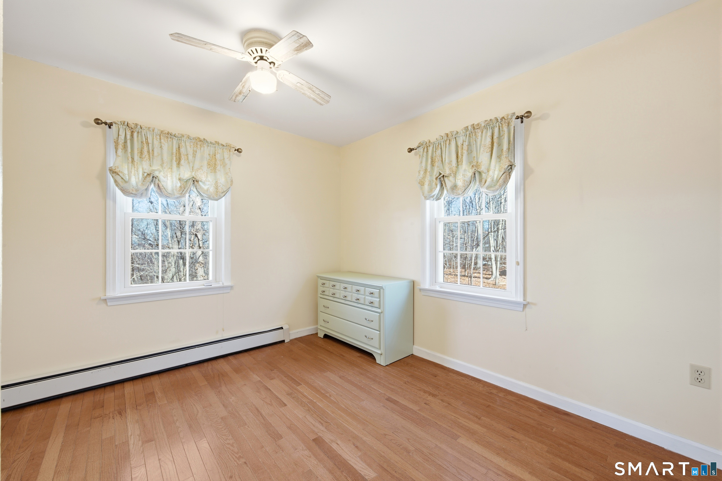 48 Bittersweet Drive Ledyard, CT 06335 - Photo 31 of 38 a view of an empty room with a window and wooden floor