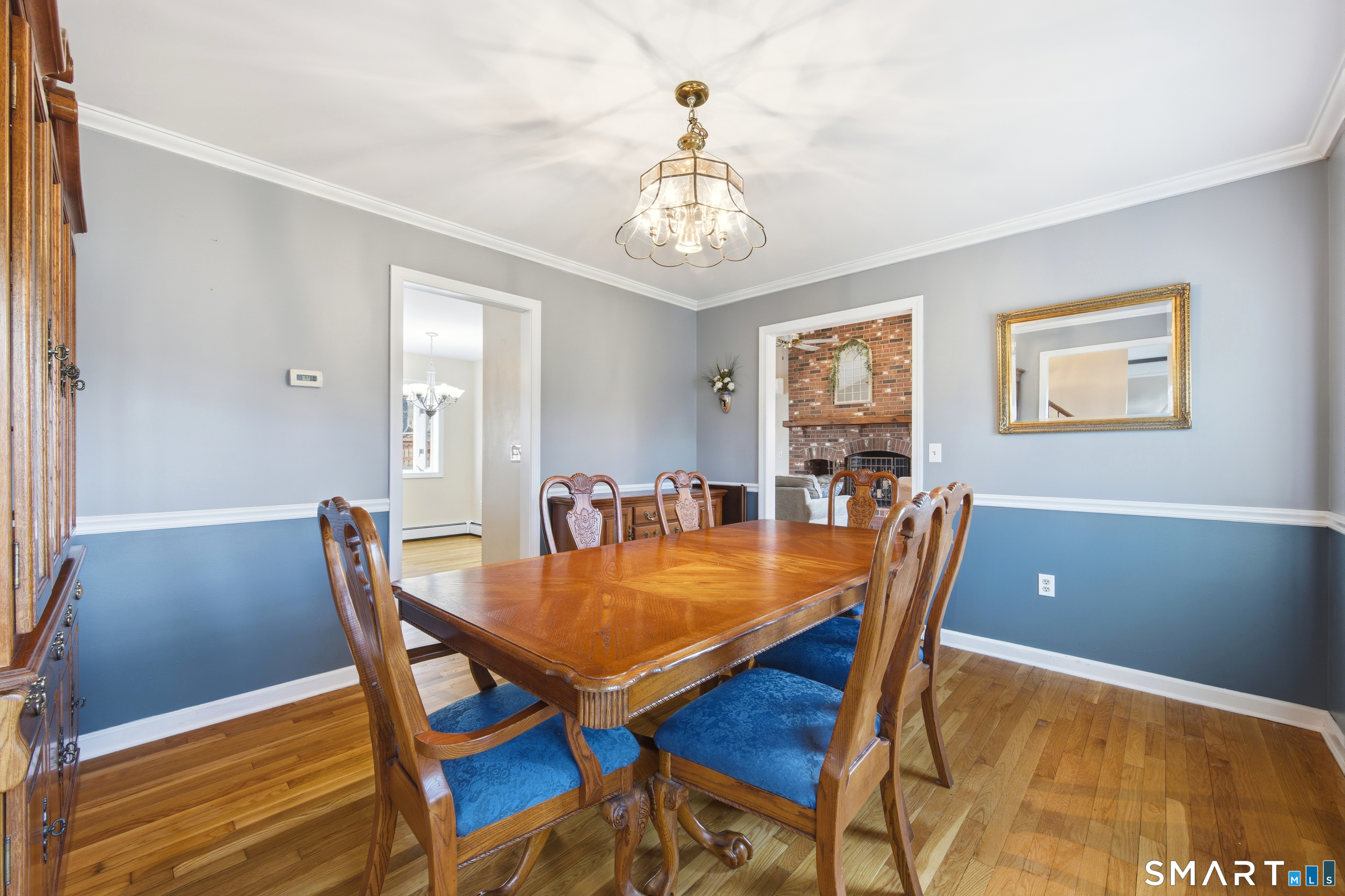 48 Bittersweet Drive Ledyard, CT 06335 - Photo 9 of 38 a view of a dining room with furniture window and wooden floor