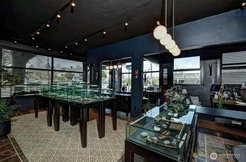 a dining room with furniture and wooden floor