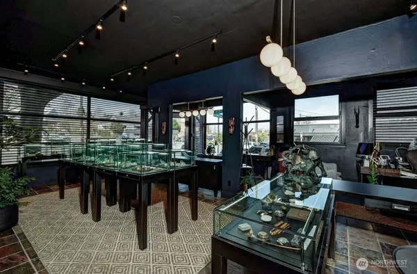 a dining room with furniture and wooden floor