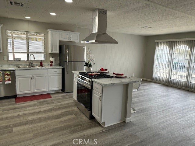 881 North Lake Street, Unit 204 Hemet, CA 92544 - Photo 5 of 10 a kitchen with stainless steel appliances granite countertop a stove a sink and a refrigerator