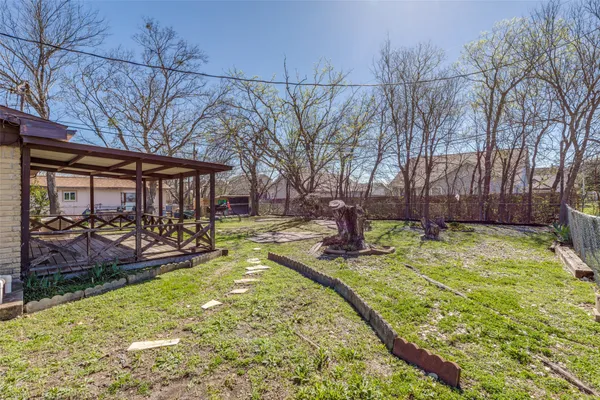 a swimming pool with outdoor seating and yard