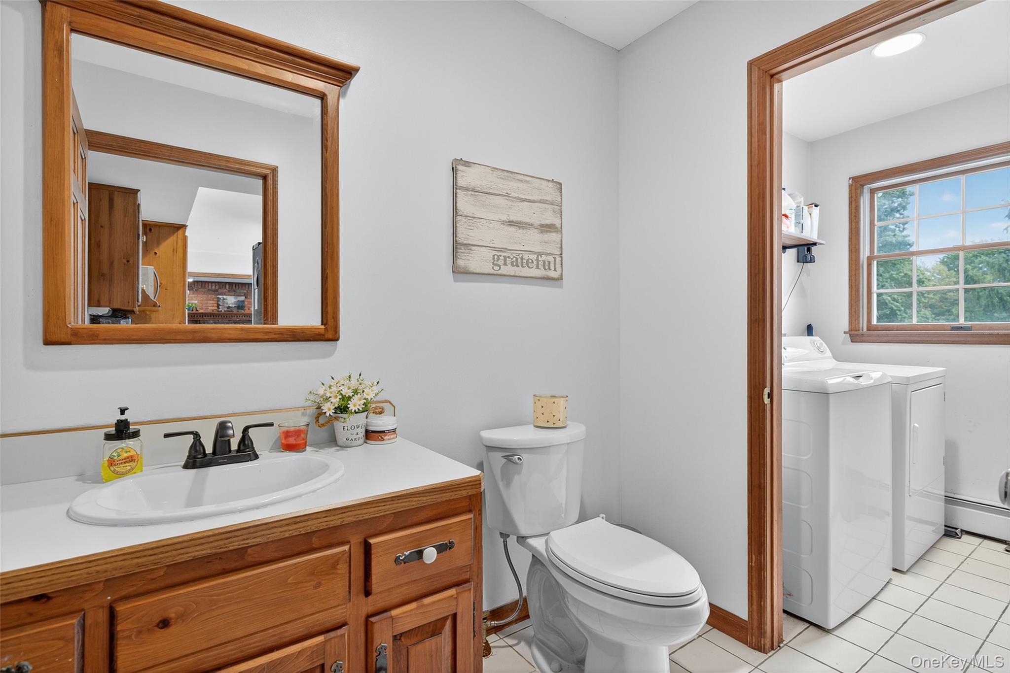 214 Dubois Road Gardiner, NY 12561 - Photo 17 of 38 a bathroom with a sink a toilet and a mirror