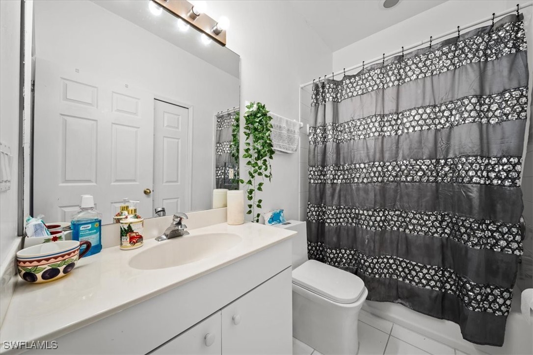 20025 Lake Vista Circle, Unit 6B LaBelle, FL 33935 - Photo 22 of 36 a bathroom with a sink toilet and shower