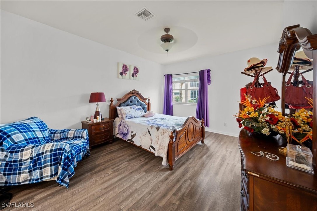 20025 Lake Vista Circle, Unit 6B LaBelle, FL 33935 - Photo 23 of 36 a bed room with furniture and a couch