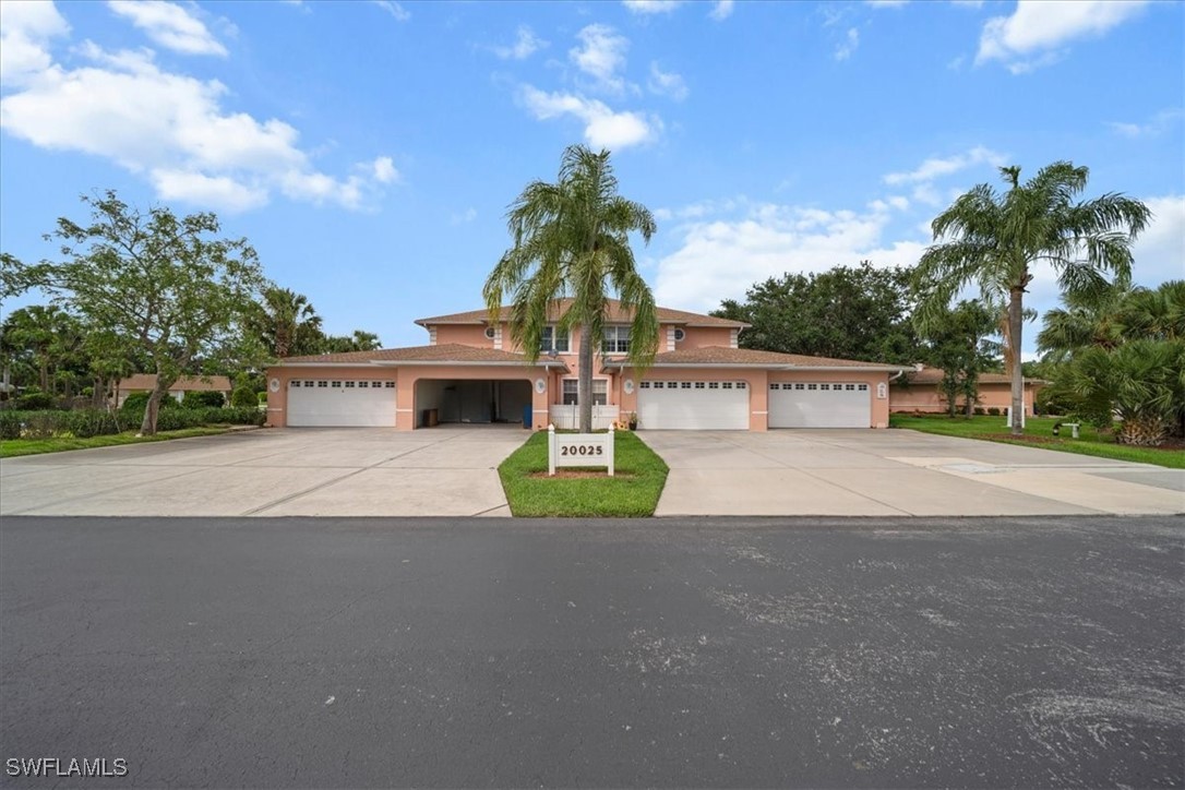 20025 Lake Vista Circle, Unit 6B LaBelle, FL 33935 - Photo 3 of 36 a front view of a house with garden