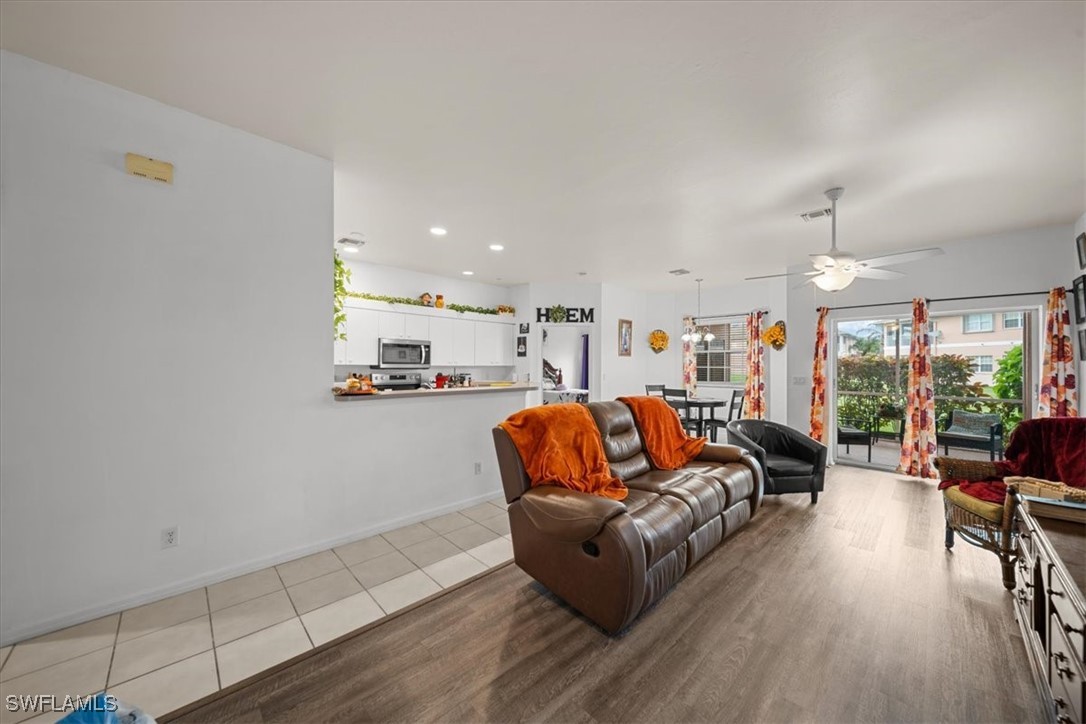 20025 Lake Vista Circle, Unit 6B LaBelle, FL 33935 - Photo 8 of 36 a living room with furniture and a large window
