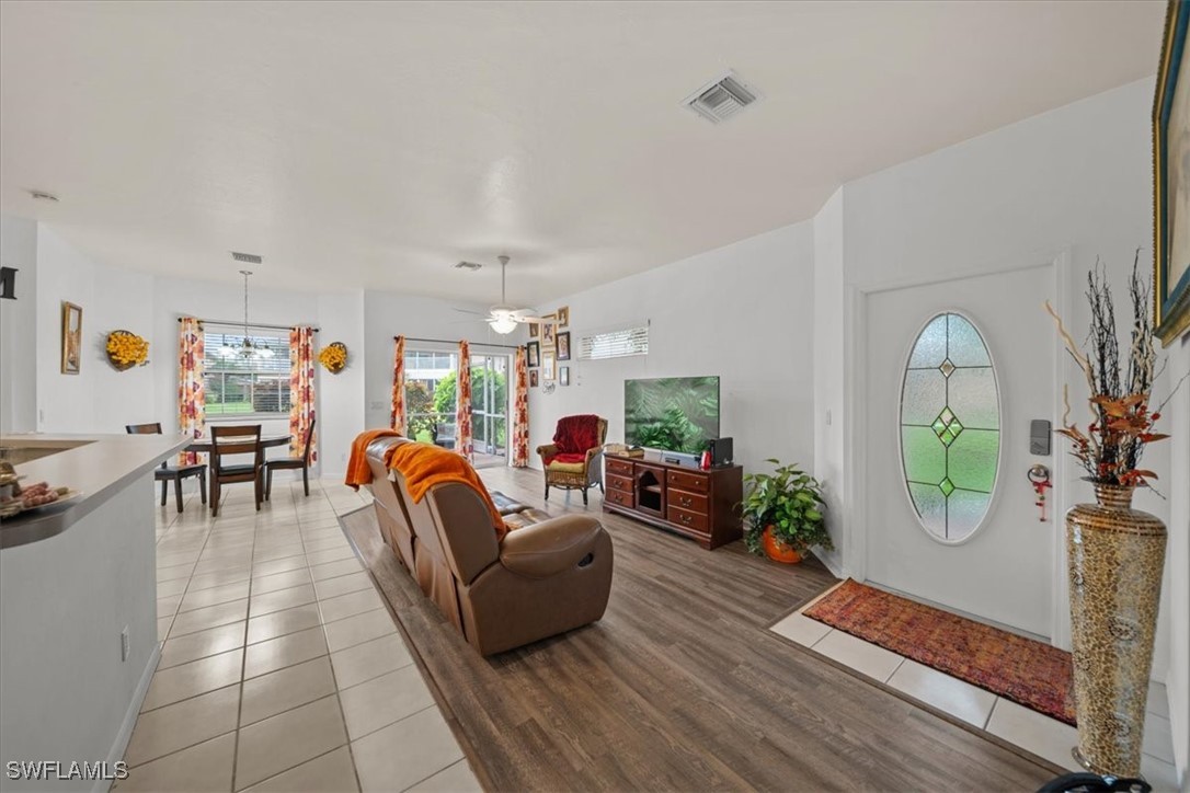 20025 Lake Vista Circle, Unit 6B LaBelle, FL 33935 - Photo 9 of 36 a living room with furniture and wooden floor