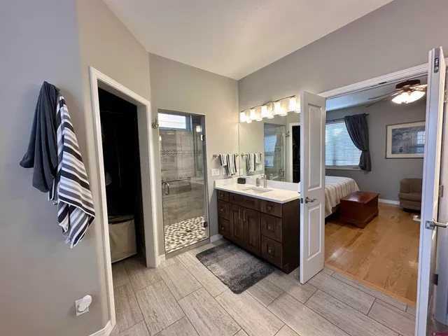 a bathroom with a double vanity sink and a mirror