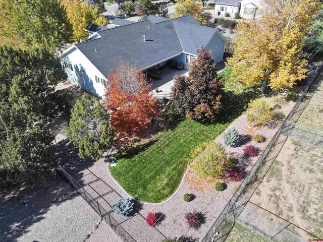 an aerial view of house with yard