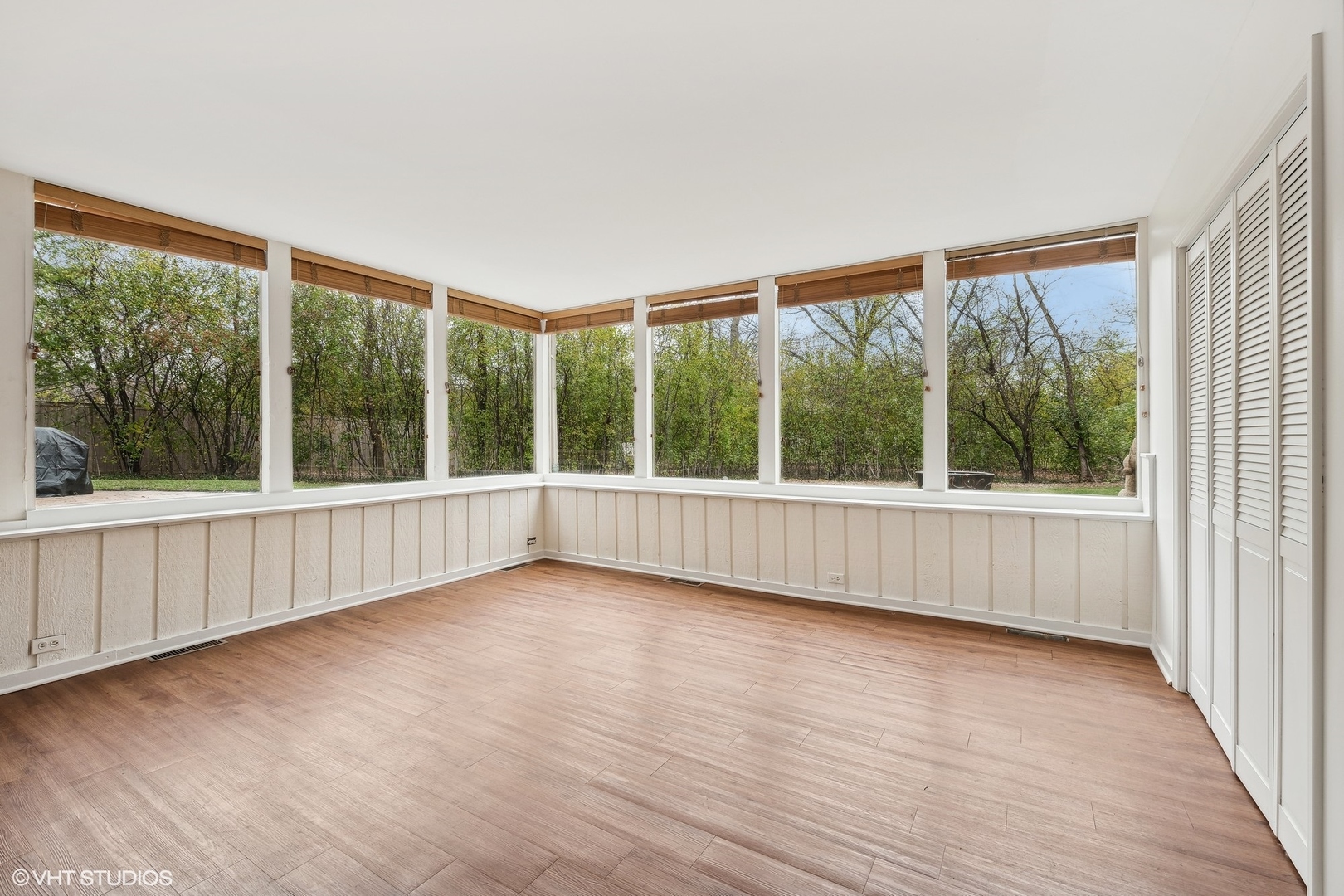 688 East Old Elm Road Lake Forest, IL 60045 - Photo 16 of 40 a view of an empty room with wooden floor and a window