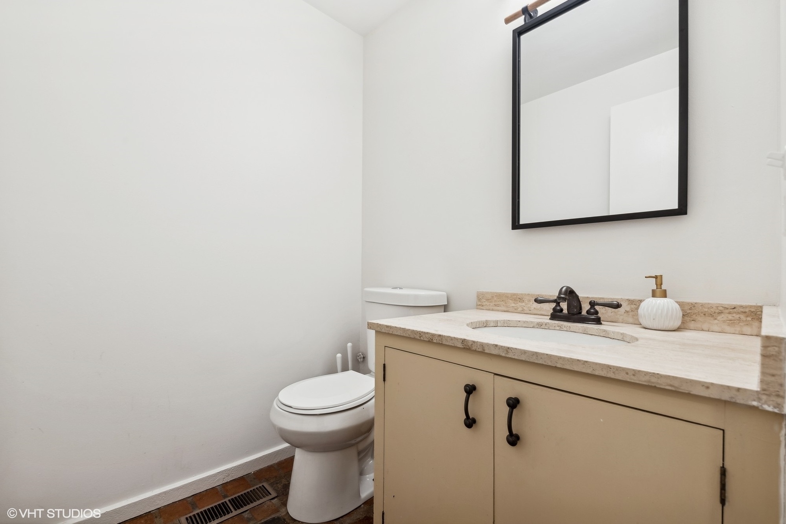 688 East Old Elm Road Lake Forest, IL 60045 - Photo 19 of 40 a bathroom with a granite countertop toilet sink and mirror